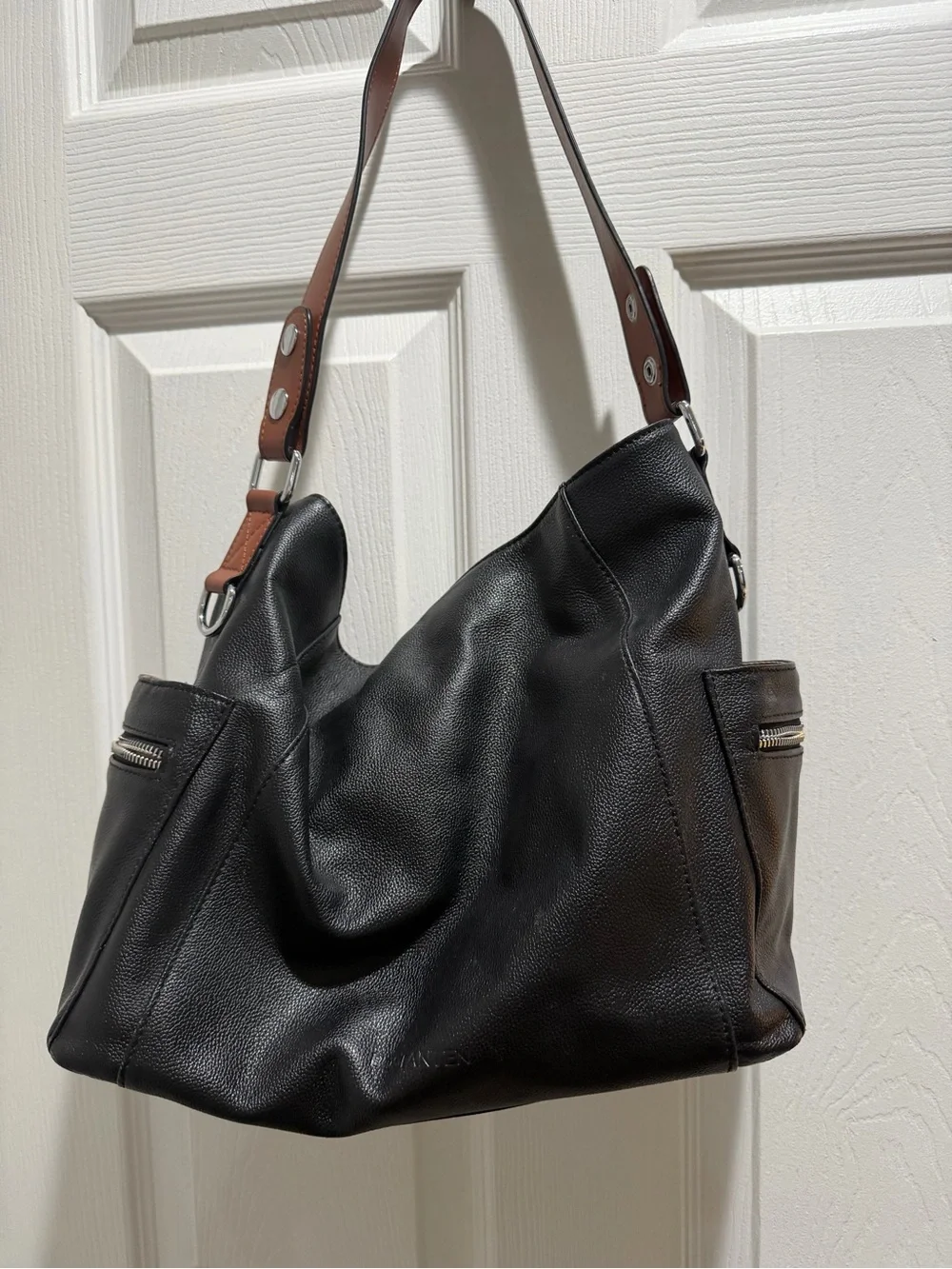 Sleek Black Leather Shoulder Bag with Brown Strap